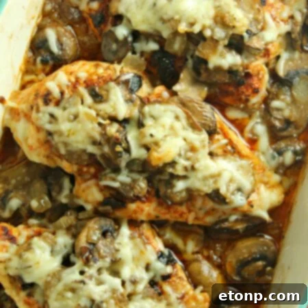 Smothered Cheesy Baked Chicken with Mushrooms