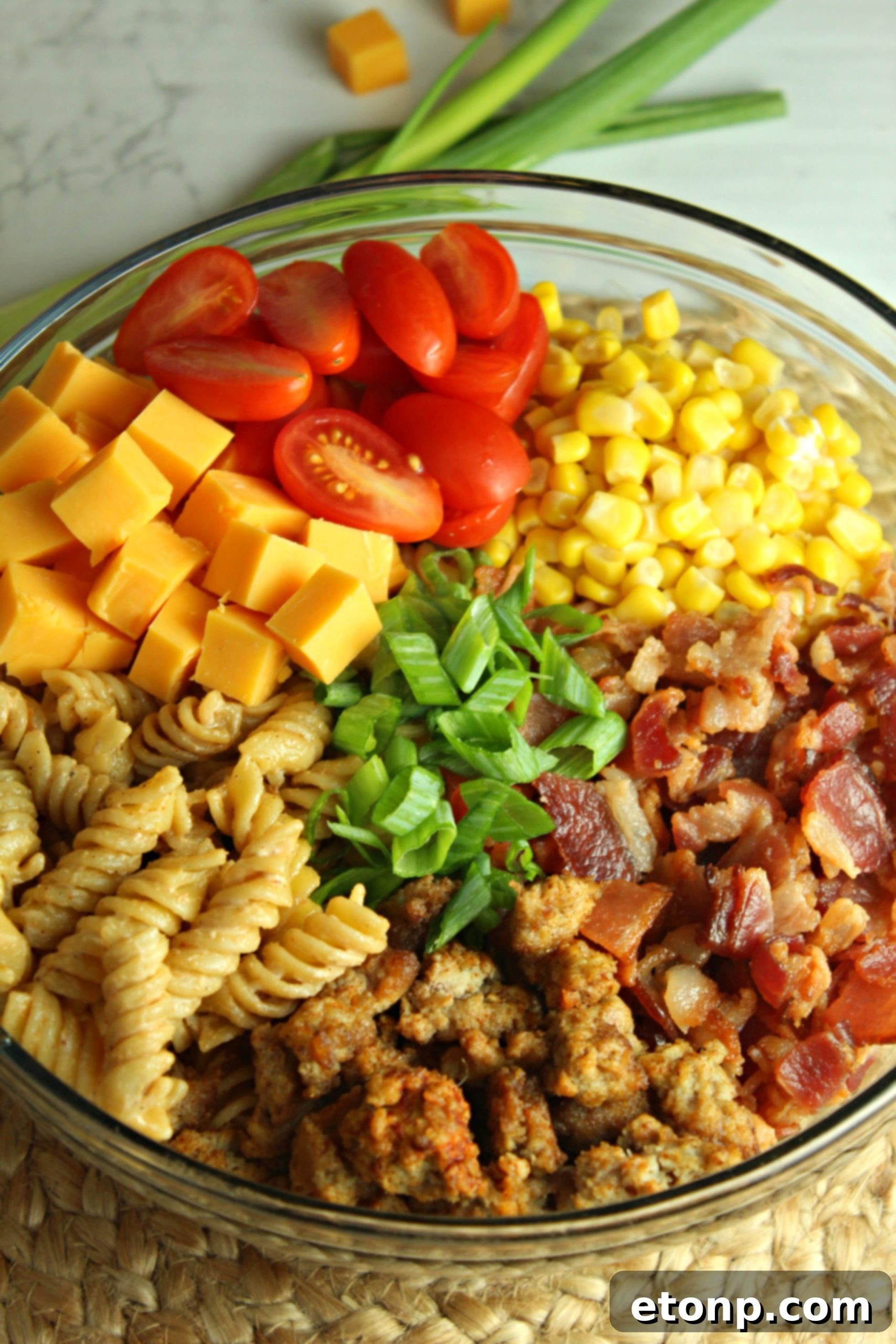 Chuckwagon Pasta Salad 3 Close-up shot of Loaded Cowboy Pasta Salad showing the rich dressing coating the ingredients, emphasizing its creamy texture.