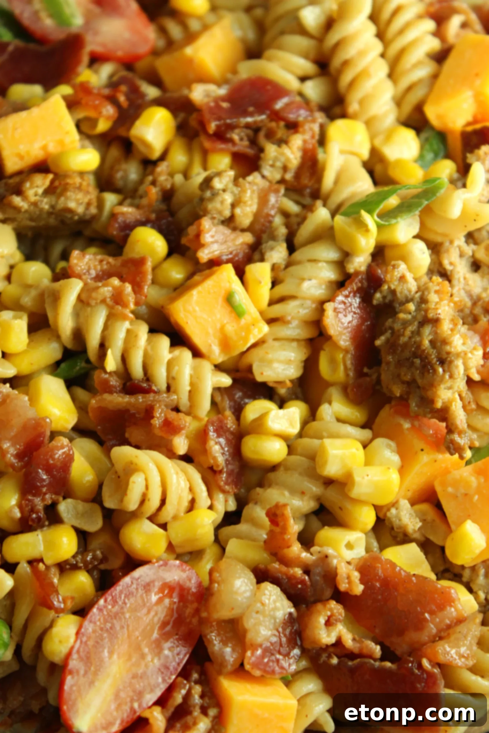 Chuckwagon Pasta Salad 5 Overhead view of Loaded Cowboy Pasta Salad in a large serving bowl, highlighting the generous mix of ingredients.