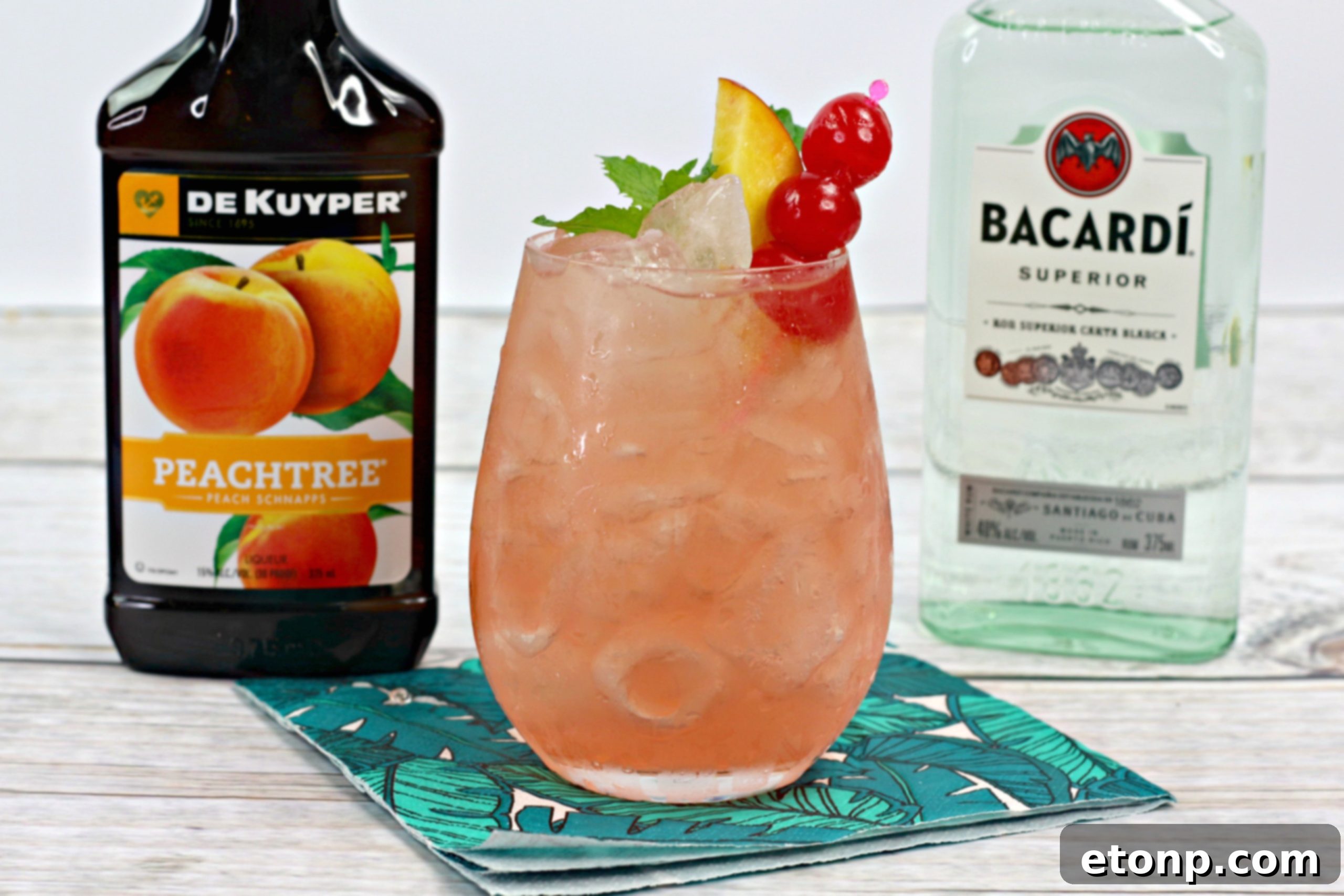 Havana Peach Nectar 5 Ingredients for a Cuban Peach Cocktail laid out: fresh peaches, white rum, peach schnapps, lime, and simple syrup, on a textured background.