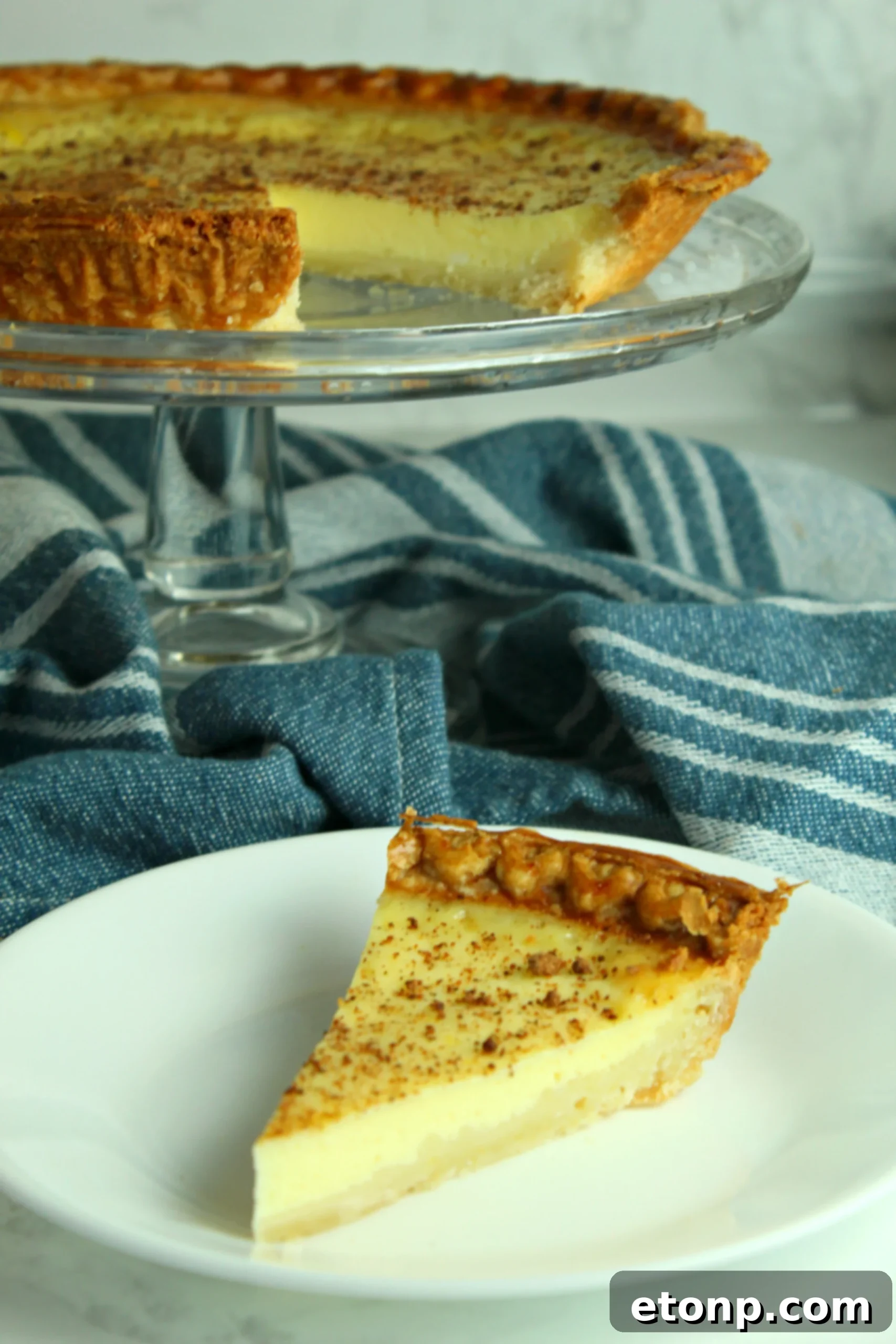 Another perspective of the creamy custard pie, highlighting its smooth, glossy surface.