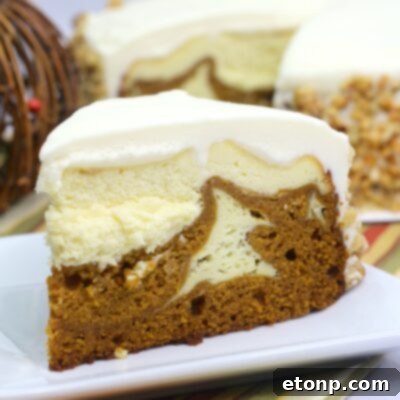 A final beautifully arranged Pumpkin Cake Cheesecake on a cooling rack, ready for its close-up