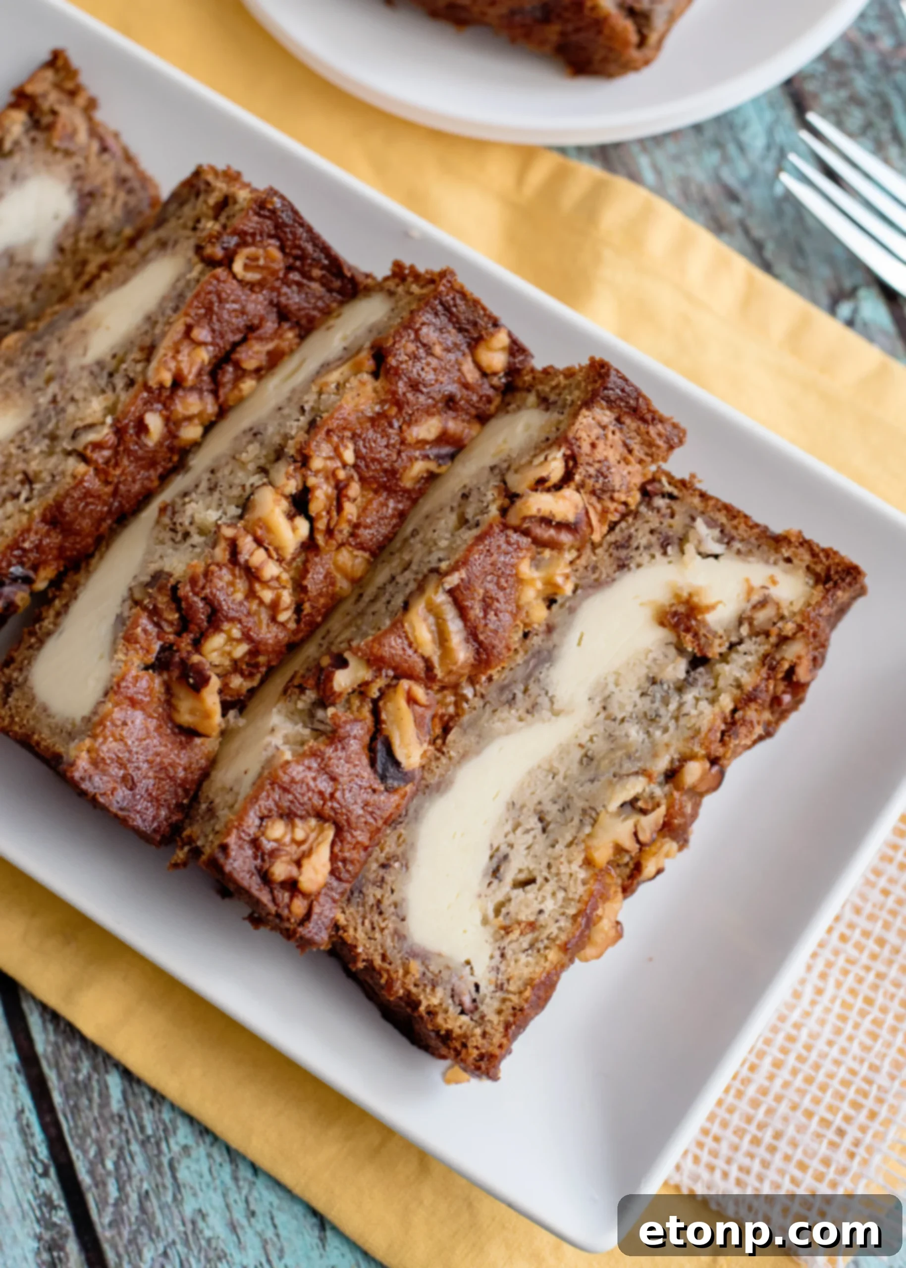Close-up of the delicious cream cheese layer in banana bread.