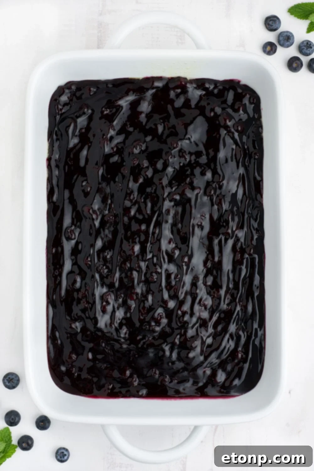 blueberry pie filling spread in pan