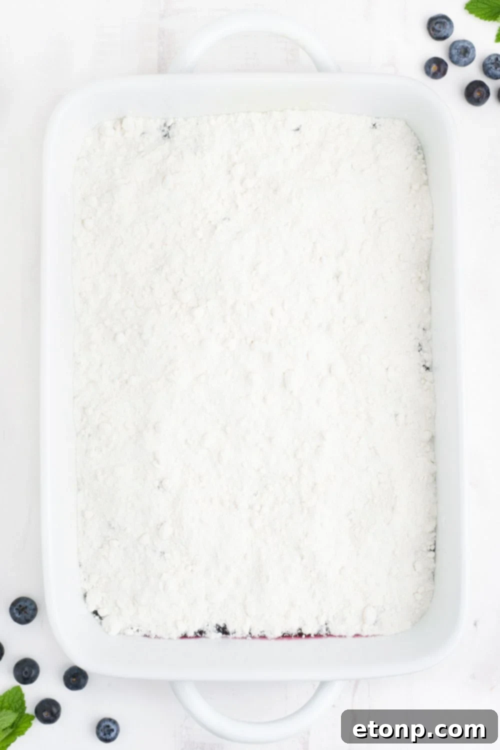 cake mix spread over the top of the cake pan