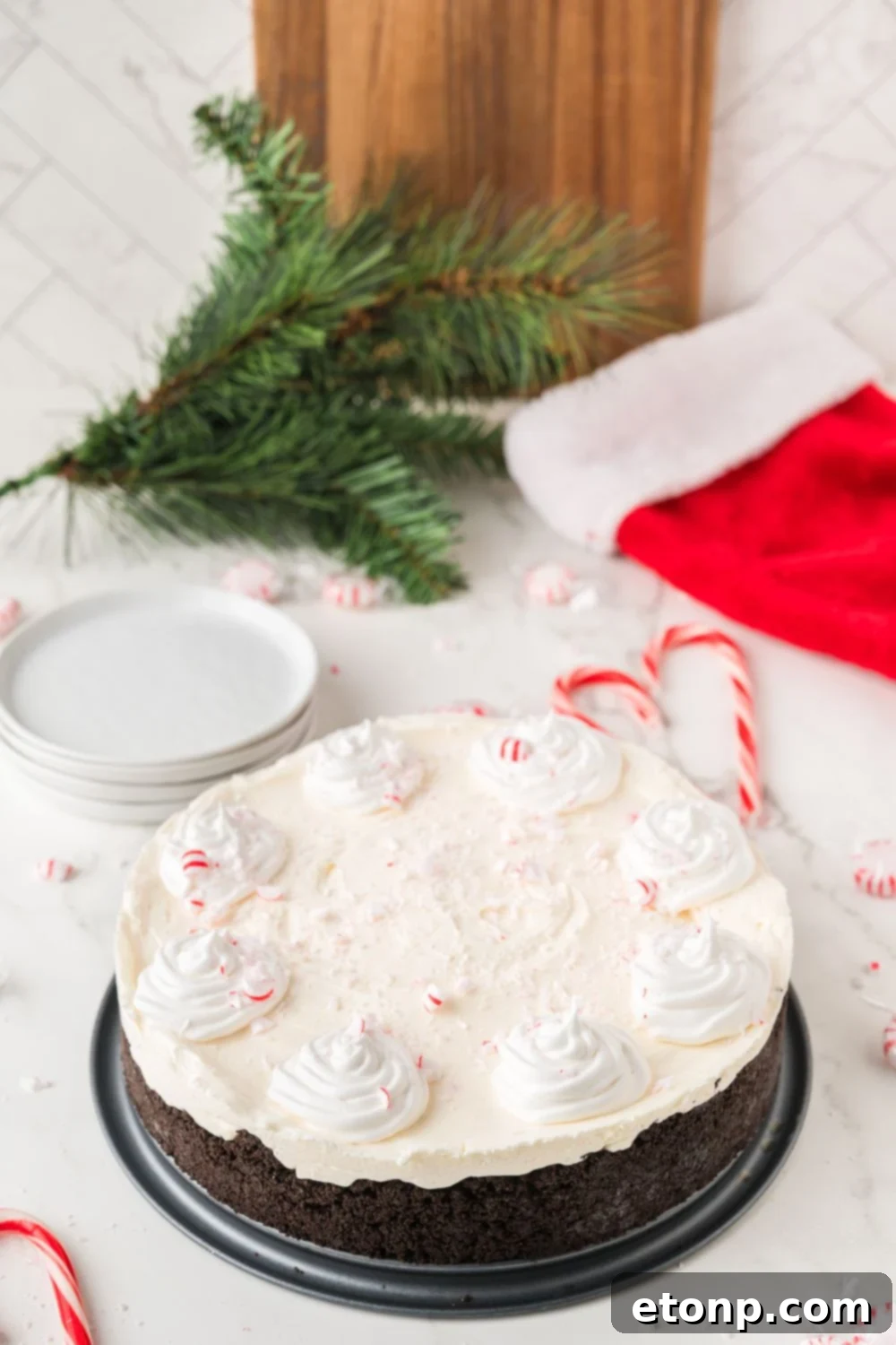 Peppermint Dream Cheesecake: A Festive No-Bake Delight 20 No Bake Peppermint Cheesecake surrounded by Christmas decorations