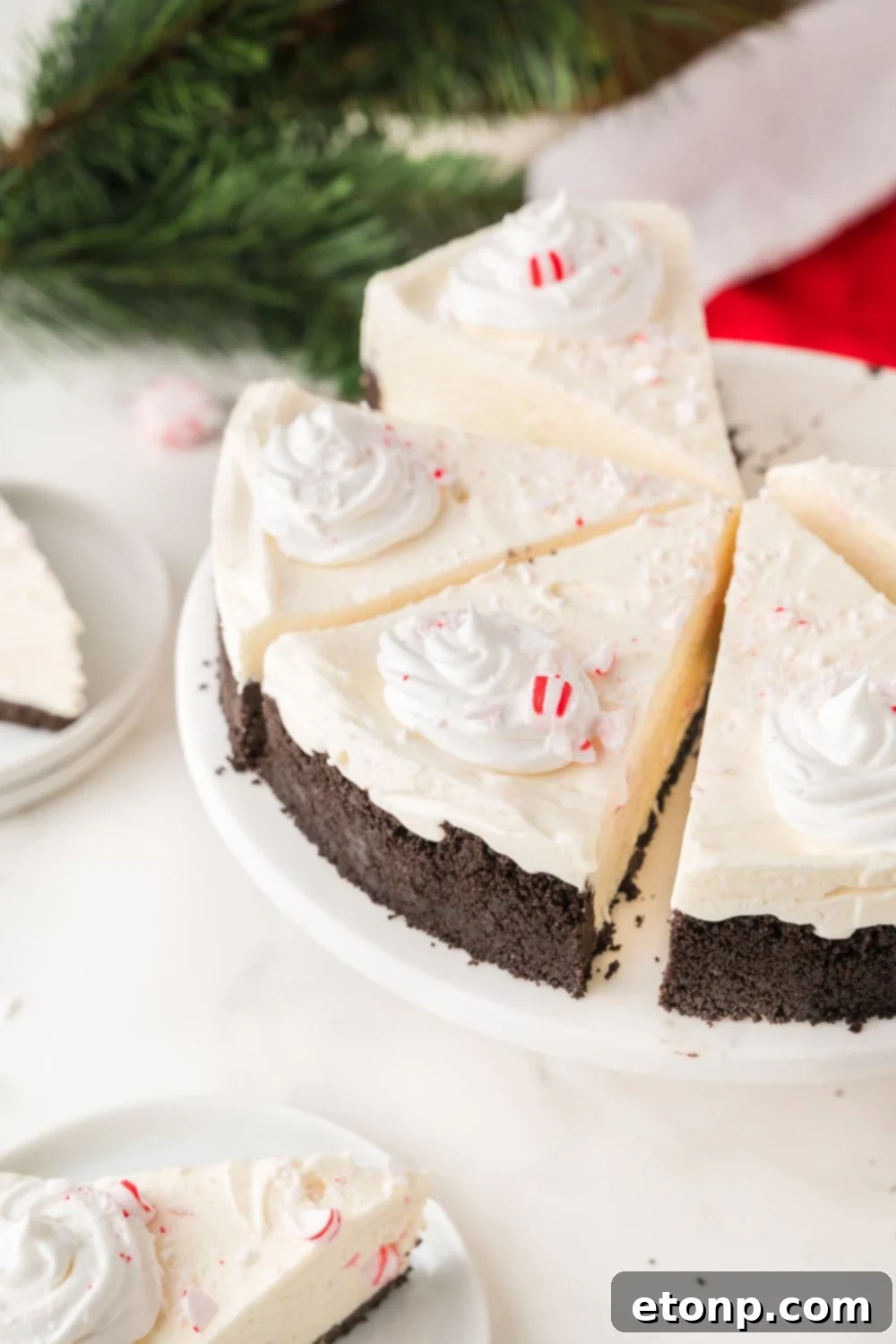 Peppermint Dream Cheesecake: A Festive No-Bake Delight 4 Slices of No Bake Peppermint Cheesecake on a platter