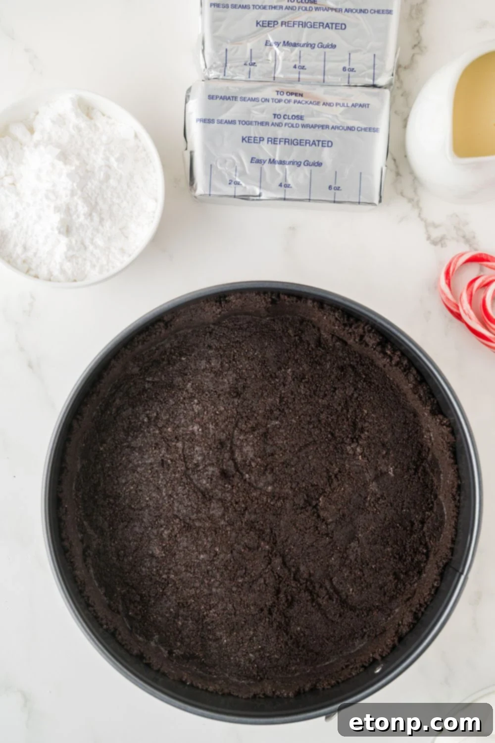 Peppermint Dream Cheesecake: A Festive No-Bake Delight 8 Oreo crust in a pie pan