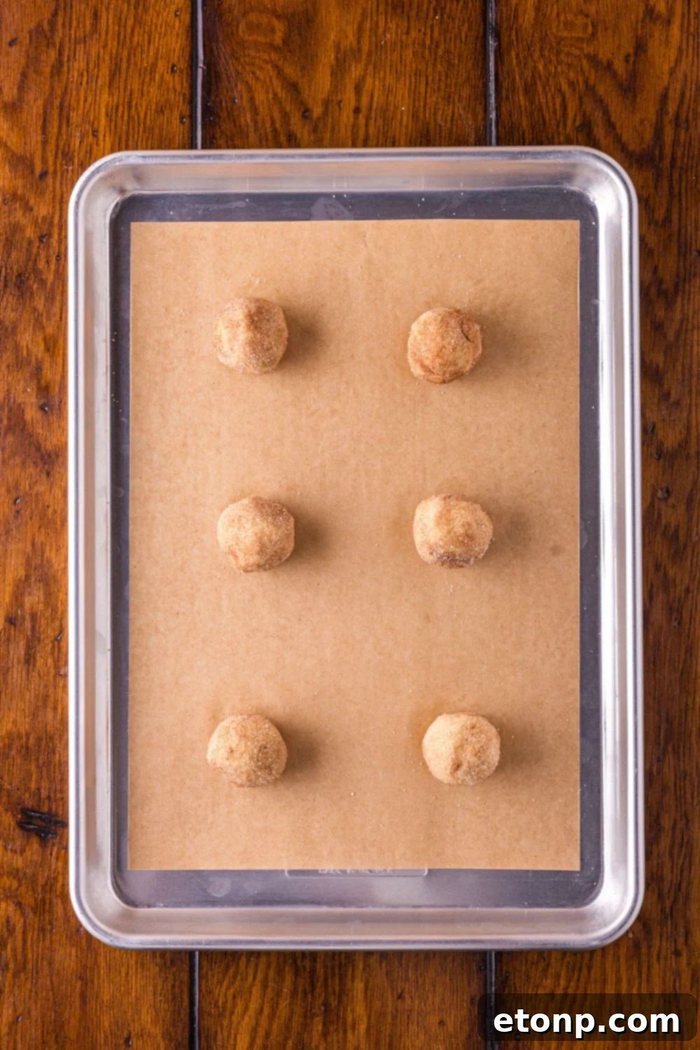 Biscoff Bliss: Soft-Baked Cinnamon Butter Cookies 13 Cookie balls for Biscoff Snickerdoodle Cookies on baking sheet