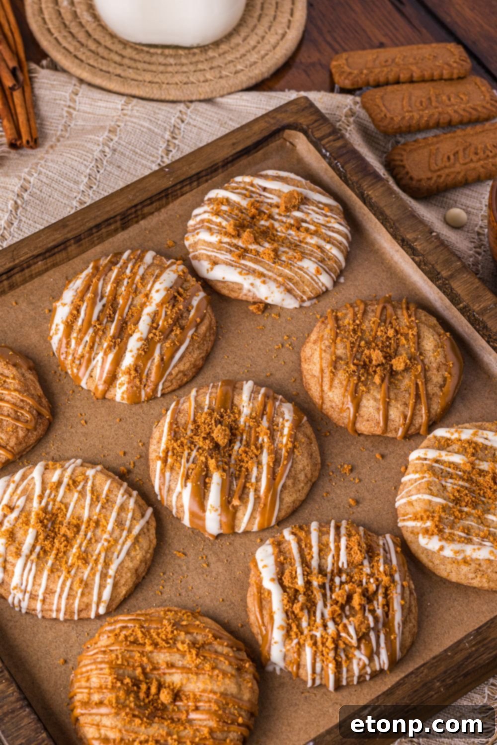 Biscoff Bliss: Soft-Baked Cinnamon Butter Cookies 27 Biscoff Snickerdoodle Cookies on a baking sheet with cookies and milk