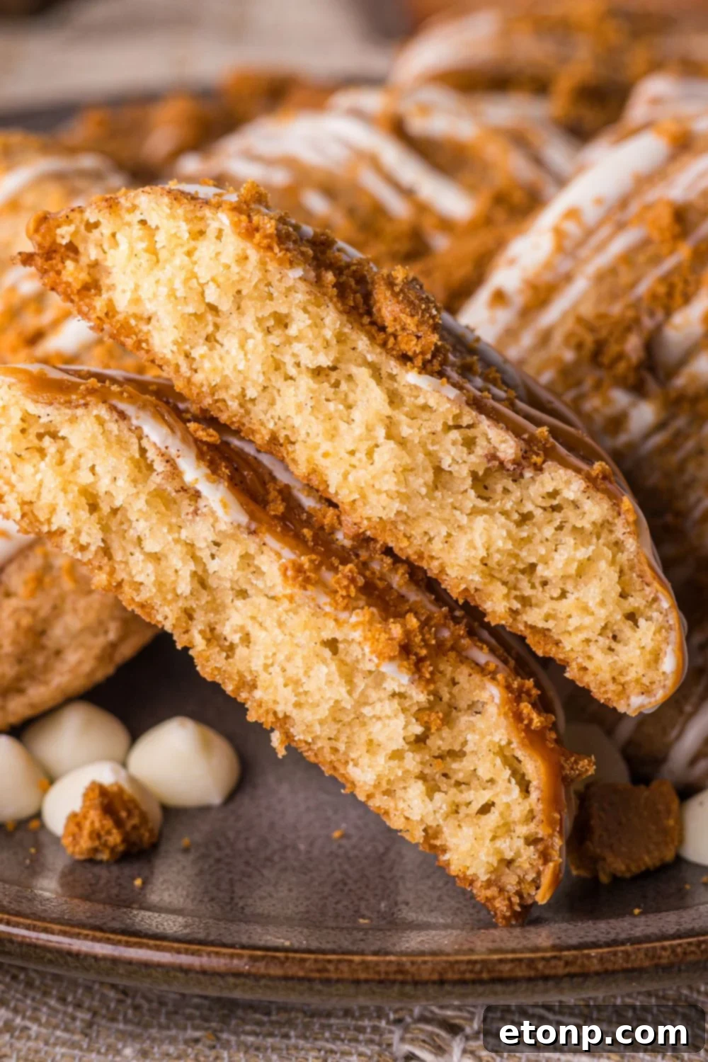 Biscoff Bliss: Soft-Baked Cinnamon Butter Cookies 31 Biscoff Snickerdoodle Cookies on plate with one cut in half