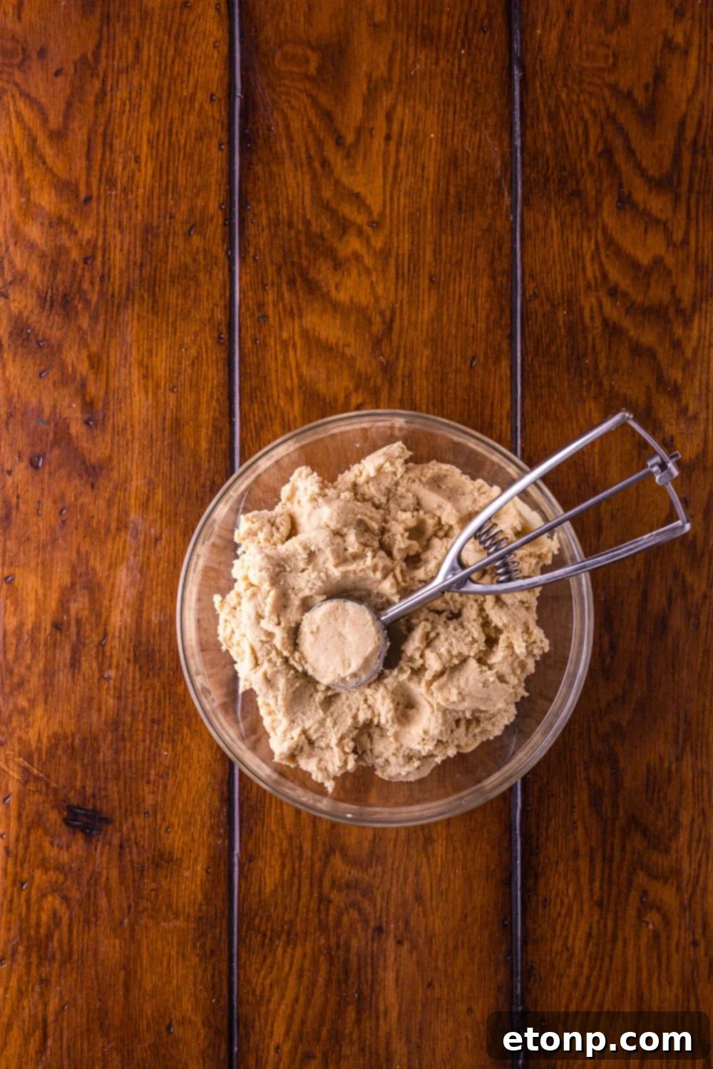 Biscoff Bliss: Soft-Baked Cinnamon Butter Cookies 10 Biscoff Snickerdoodle Cookie dough with a cookie scoop