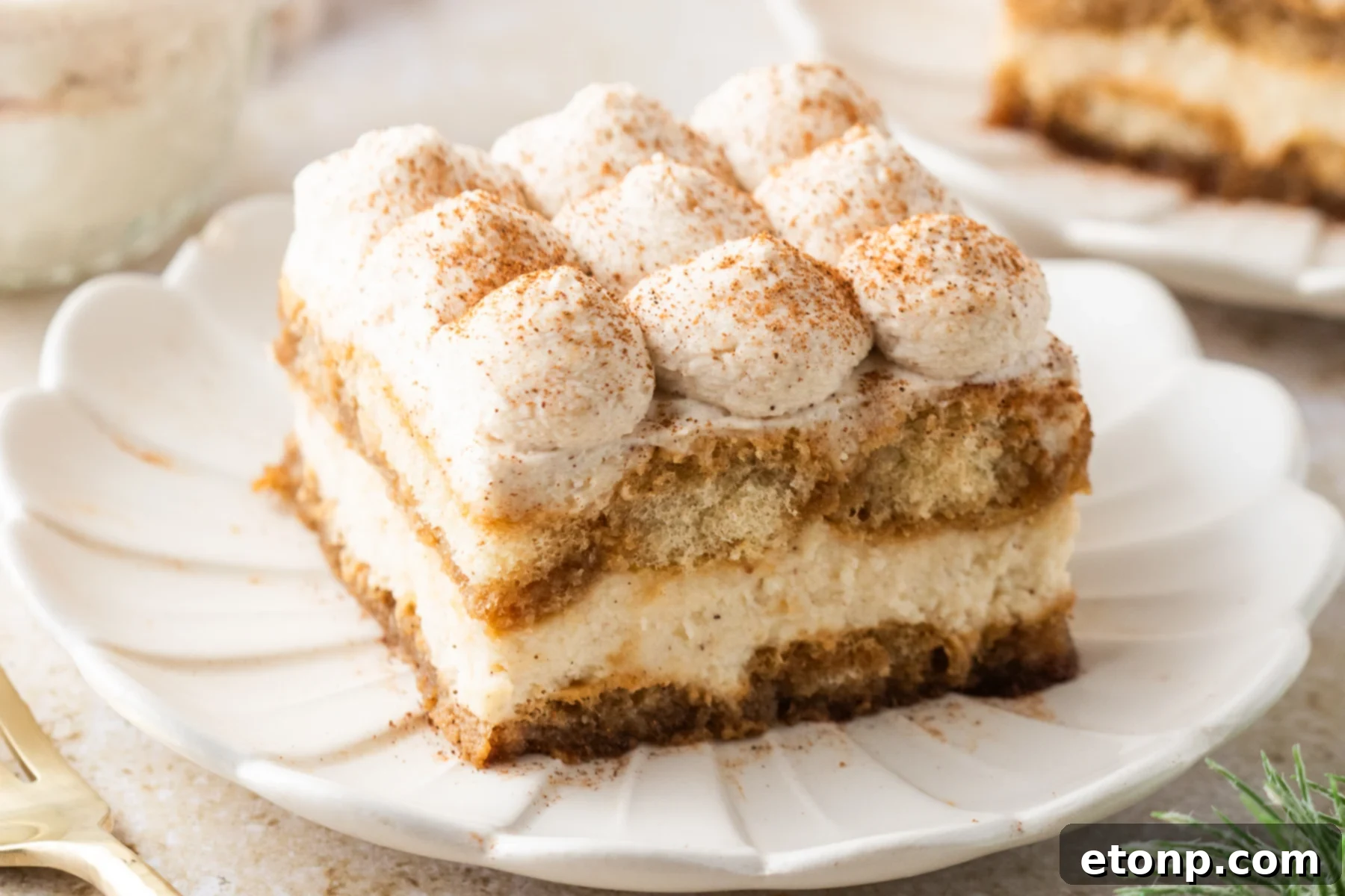 Eggnog Tiramisu: A Festive Holiday Treat 27 No Bake Eggnog Tiramisu sliced on white serving plates
