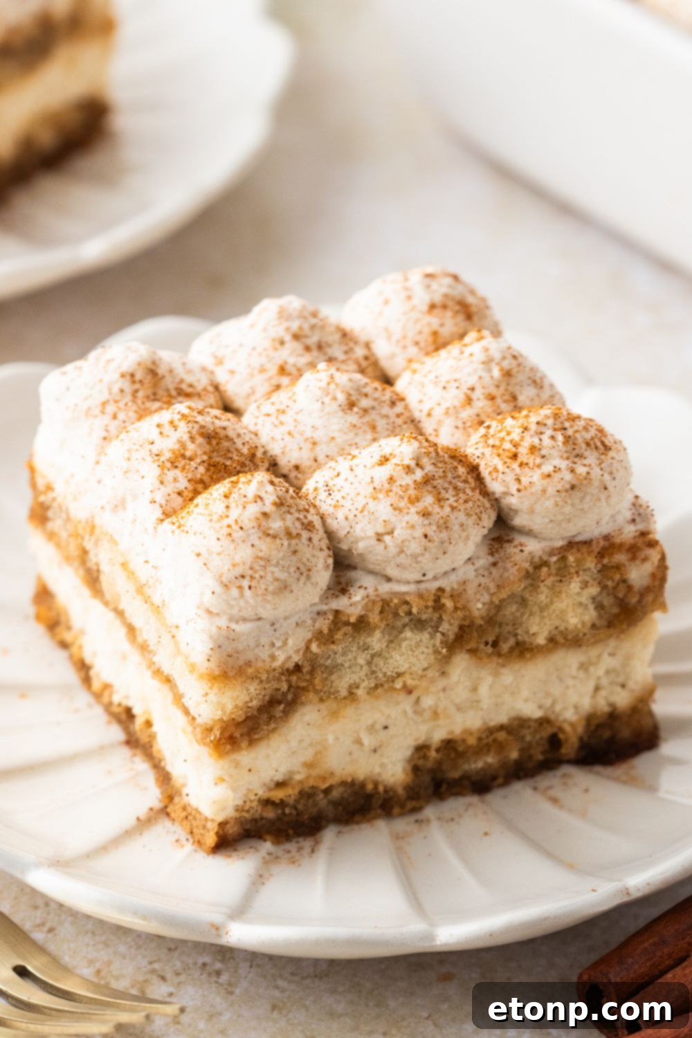 Eggnog Tiramisu: A Festive Holiday Treat 4 Looking at the table with plates with slices of Eggnog Tiramisu