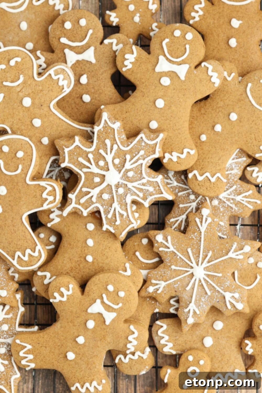 Christmas gingerbread cookies scattered on a table.