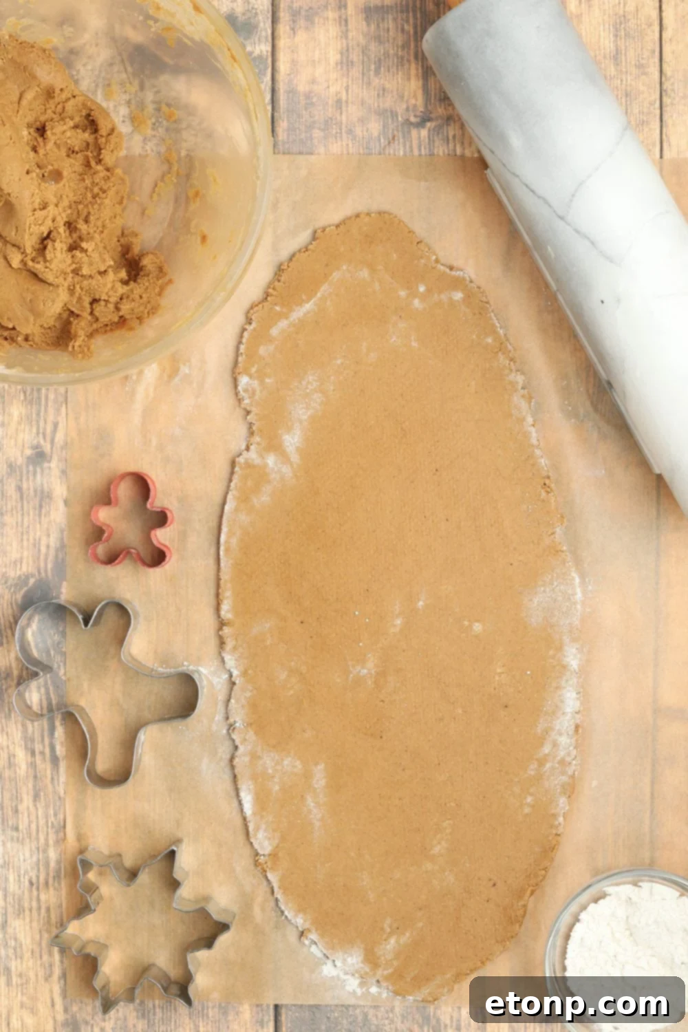 Rolled out cookie dough on a table.