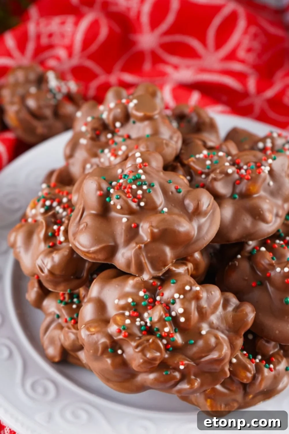Slow Cooker Holiday Fudge: 4-Ingredient Magic 12 Crockpot Christmas Candy stacked on a plate