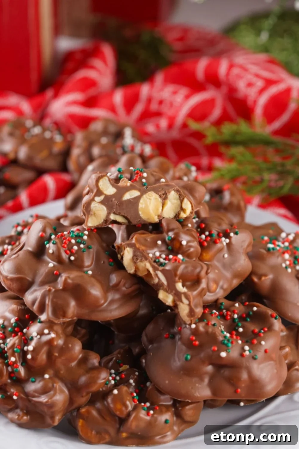 Slow Cooker Holiday Fudge: 4-Ingredient Magic 4 Crockpot Christmas Candy stacked on a plate