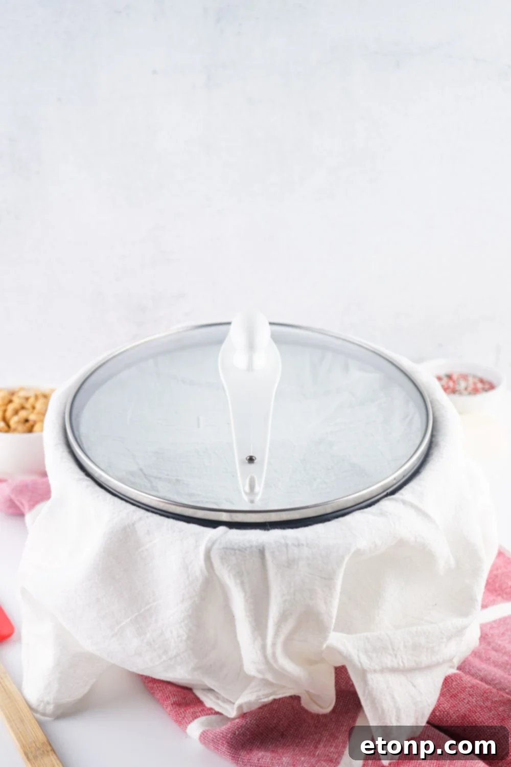 Slow Cooker Holiday Fudge: 4-Ingredient Magic 8 Crockpot with a towel over it