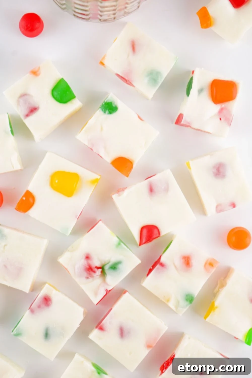 Holiday Gumdrop Nougat: A Nostalgic Christmas Treat 3 Christmas Gumdrop Nougat Candy sliced into cubes on a white table