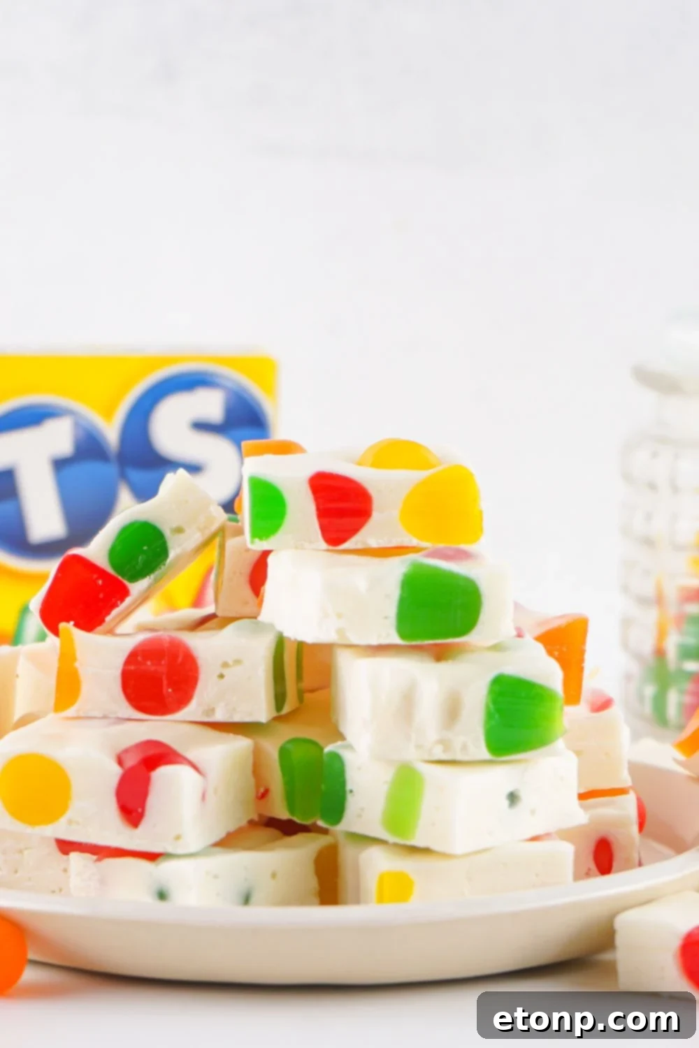 Holiday Gumdrop Nougat: A Nostalgic Christmas Treat 10 Stack of Christmas Gumdrop Nougat Candy on a plate with a box of dot candy behind it