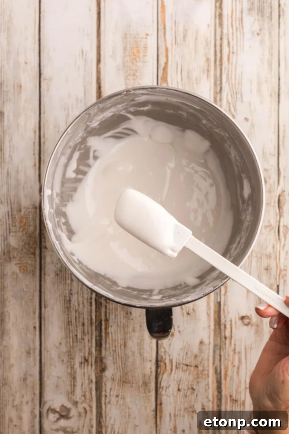 Adorned Sugar Cookies: Soft, Shapely, and Icing-Ready 16 Royal icing in a metal bowl.