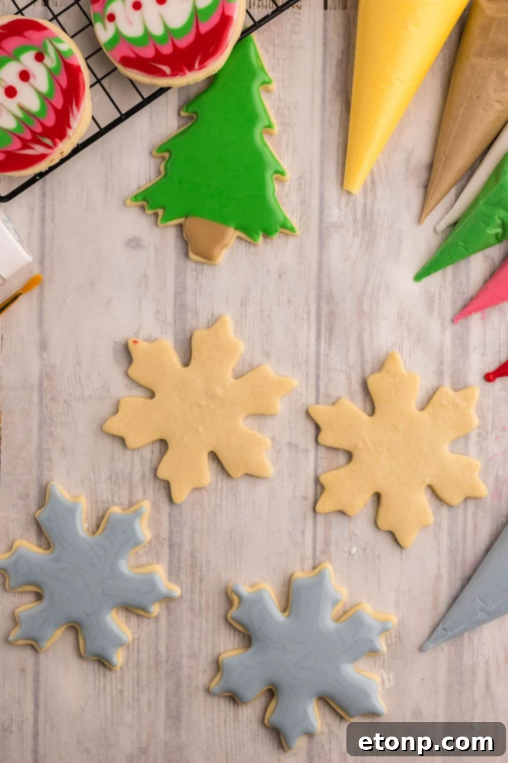 Adorned Sugar Cookies: Soft, Shapely, and Icing-Ready 19 Snowflake-shaped Decorated Sugar Cookies.