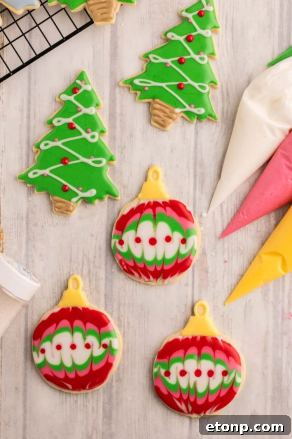 Adorned Sugar Cookies: Soft, Shapely, and Icing-Ready 21 Decorated Sugar Cookies with royal icing, themed like Christmas ornaments and trees.