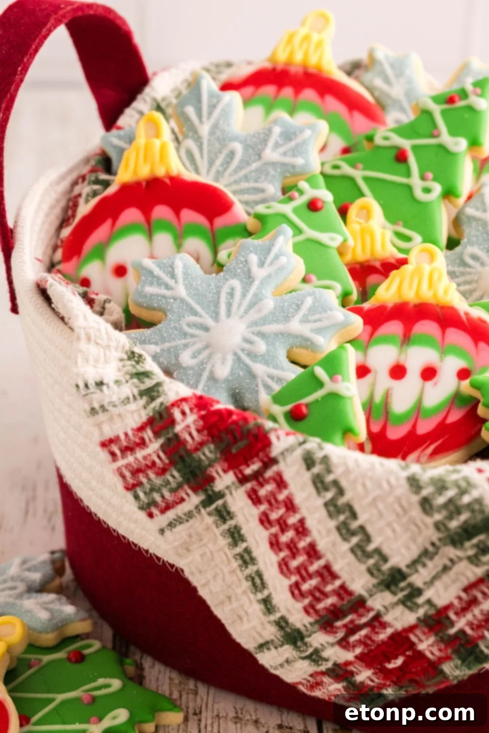 Adorned Sugar Cookies: Soft, Shapely, and Icing-Ready 27 Christmas sugar cookies in a tin.