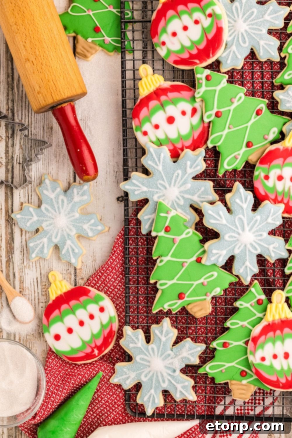 Adorned Sugar Cookies: Soft, Shapely, and Icing-Ready 31 Decorated Sugar Cookies in shapes of snowflakes, ornaments, and trees.