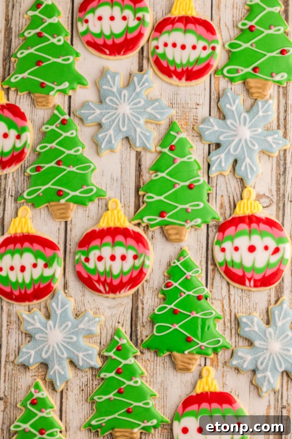 Adorned Sugar Cookies: Soft, Shapely, and Icing-Ready 37 Christmas-themed Decorated Sugar Cookies spread out on a table.