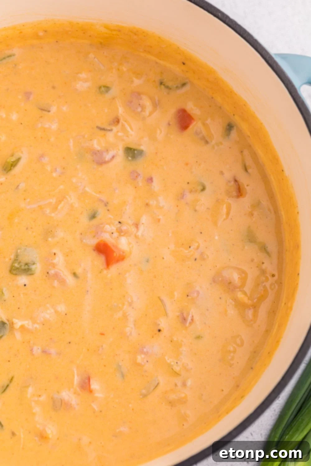 Stock pot full of cheesy jalapeño popper crack chicken soup on the table