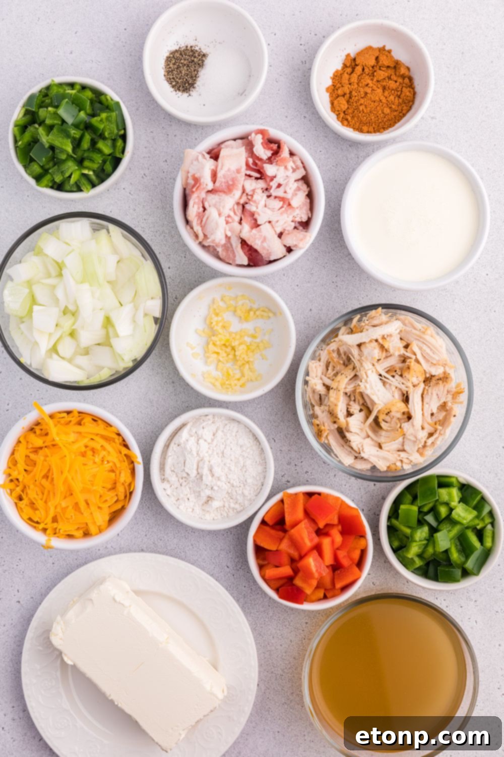 Bowls full of ingredients for the soup on the table for making jalapeño popper crack chicken soup