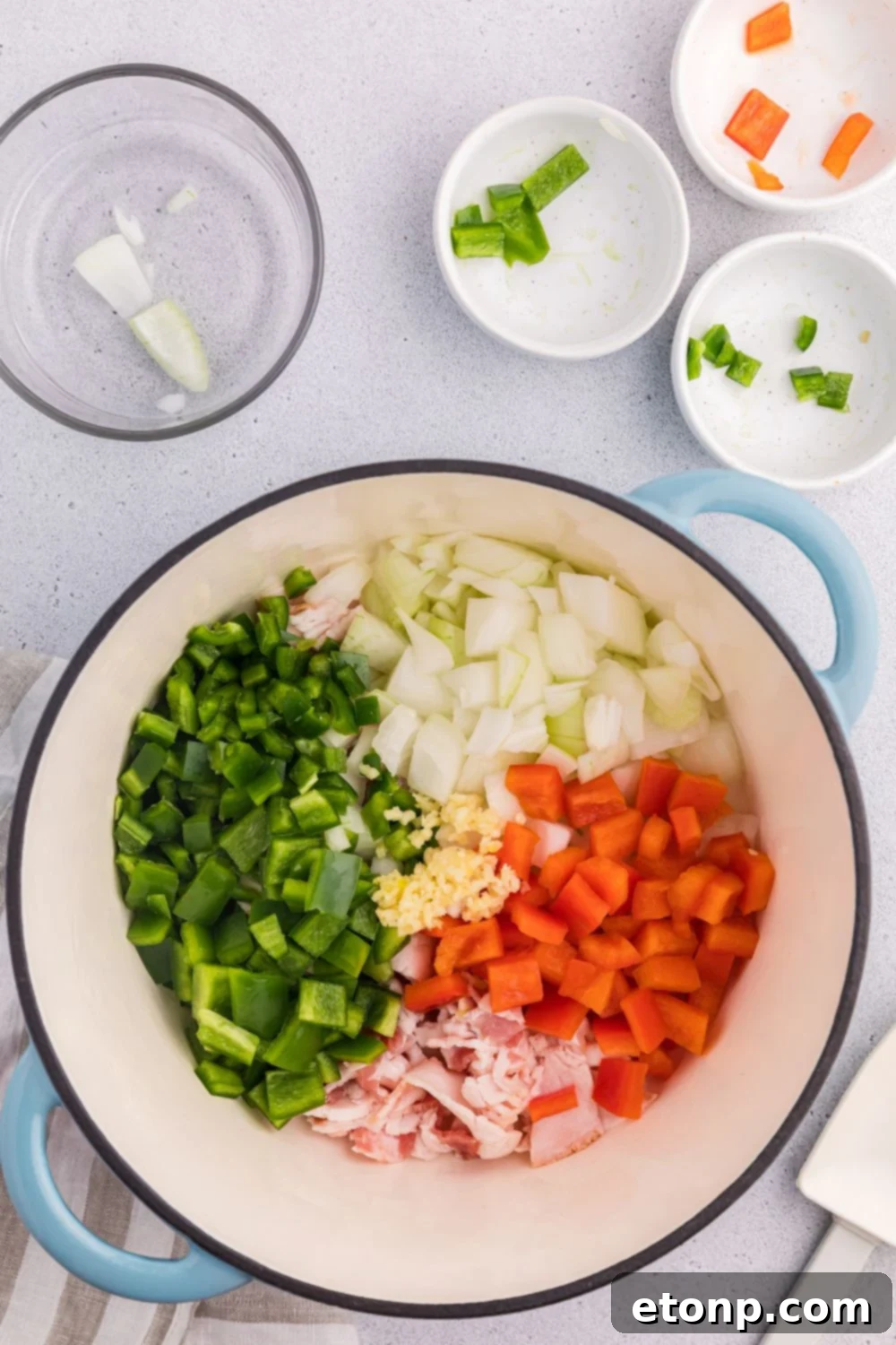 Peppers and other veggies in a stockpot on the table