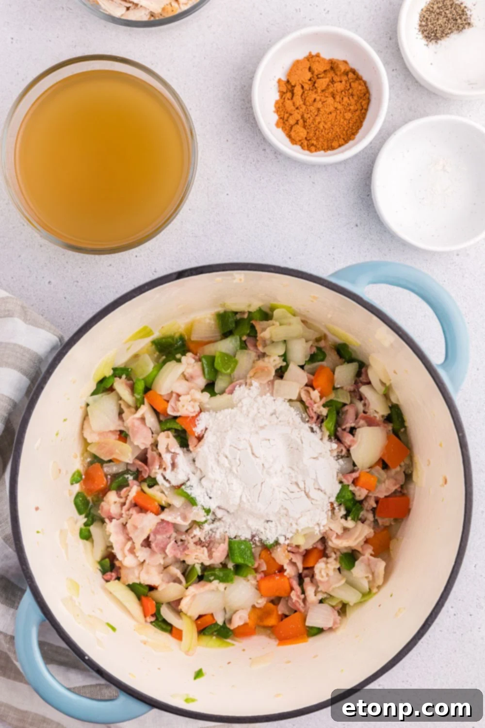 Cornstarch on table with veggies and chicekn on the table