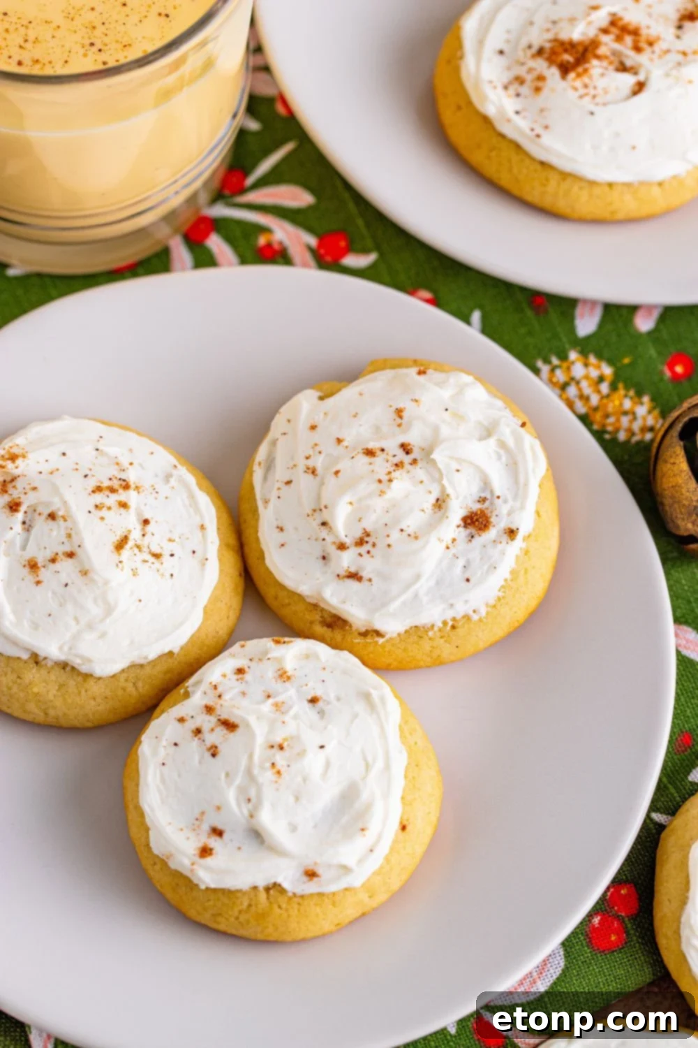 Soft Frosted Eggnog Cookies (Bakery Style Holiday Cookies) Delectable Holiday Eggnog Delights 18 Soft Frosted Eggnog Cookies on white plates