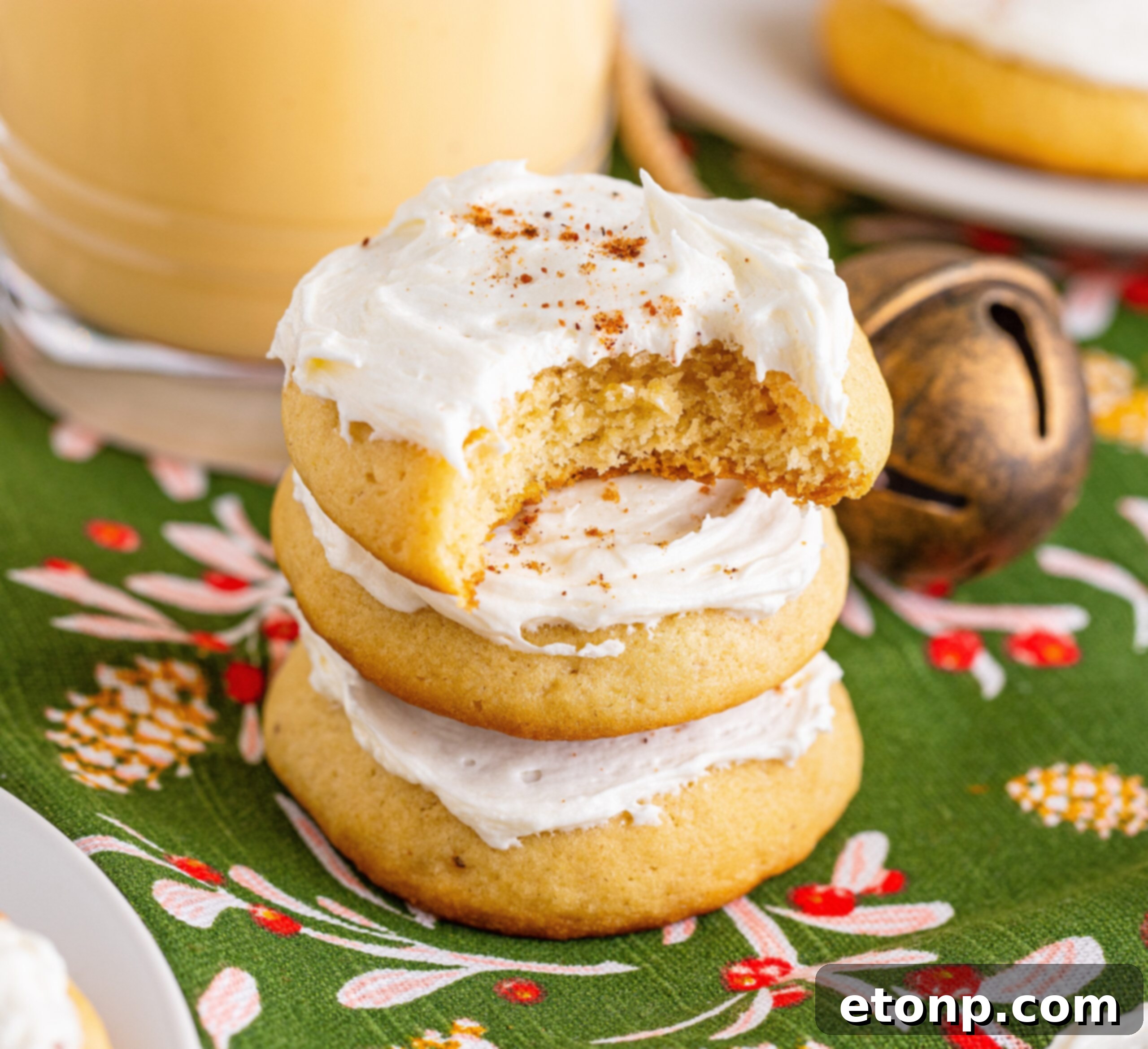Soft Frosted Eggnog Cookies (Bakery Style Holiday Cookies) Delectable Holiday Eggnog Delights 21 Soft Frosted Eggnog Cookies with a bite missing