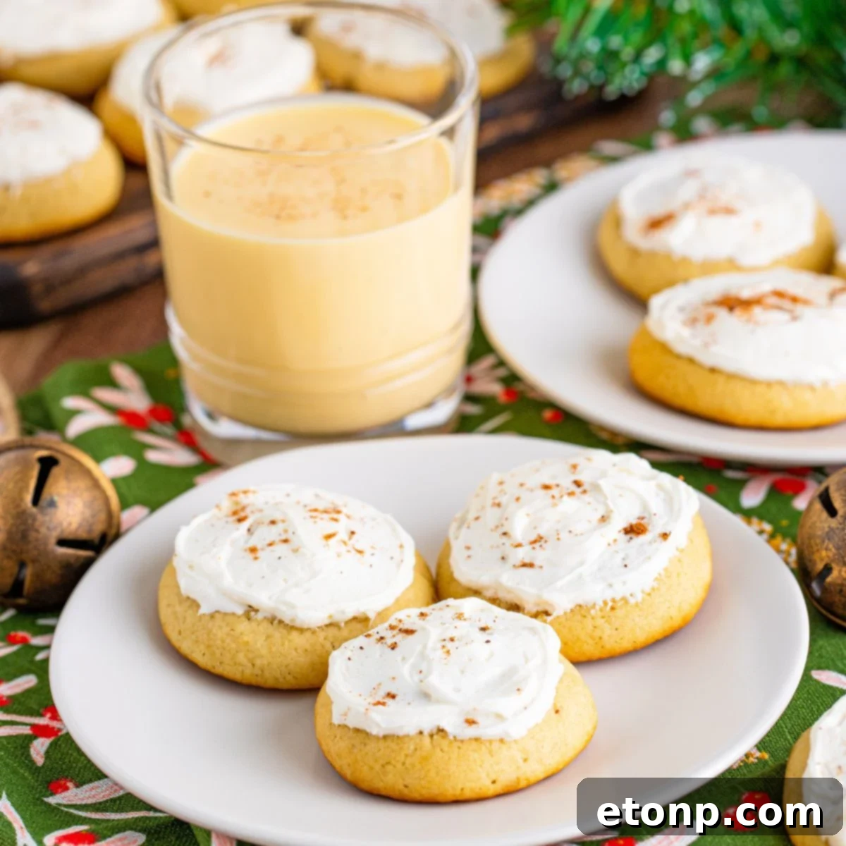 Soft Frosted Eggnog Cookies (Bakery Style Holiday Cookies) Delectable Holiday Eggnog Delights 24 Soft Frosted Eggnog Cookies on plates with eggnog
