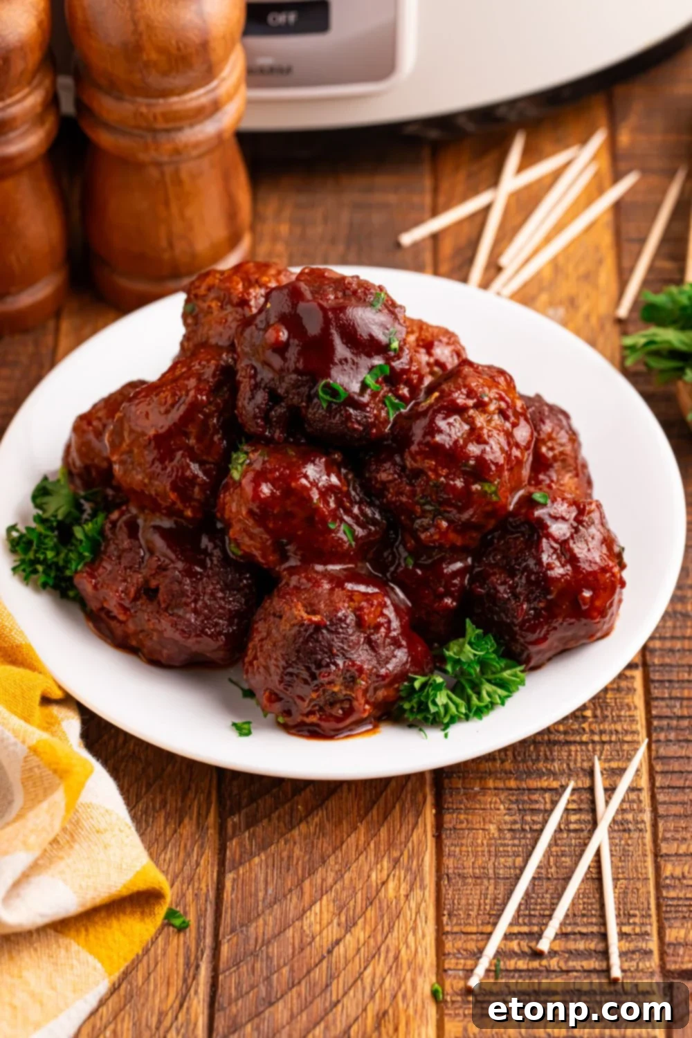 Slow-Cooker BBQ Meatball Magic 15 Crockpot Homemade BBQ Meatballs plated with toothpicks