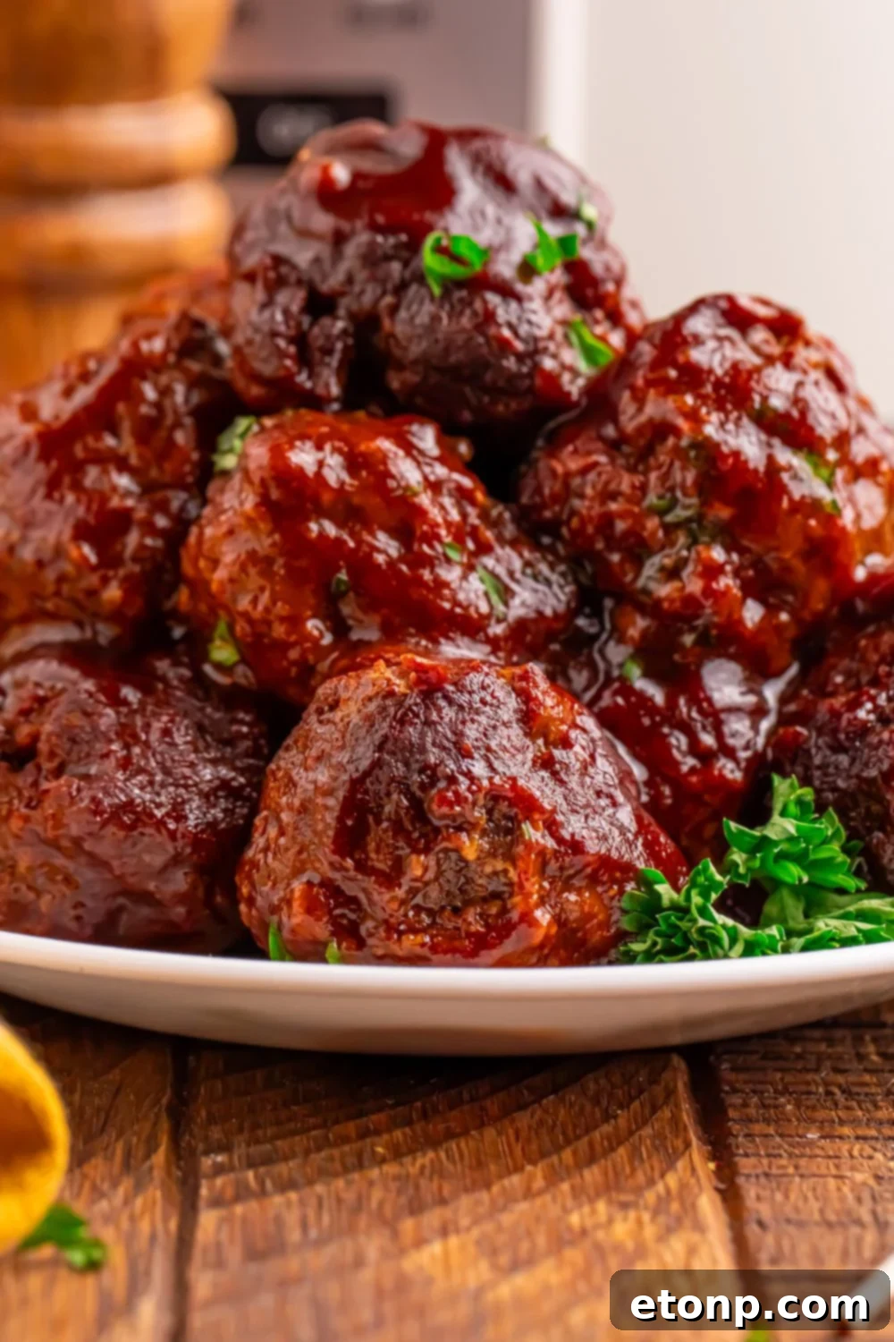 Slow-Cooker BBQ Meatball Magic 17 Crockpot Homemade BBQ Meatballs served on a plate