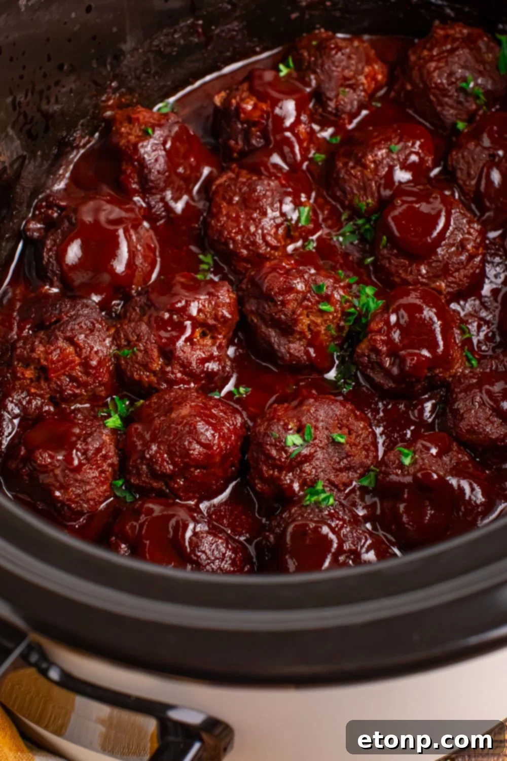 Slow-Cooker BBQ Meatball Magic 18 Crockpot Homemade BBQ Meatballs simmering in a CrockPot