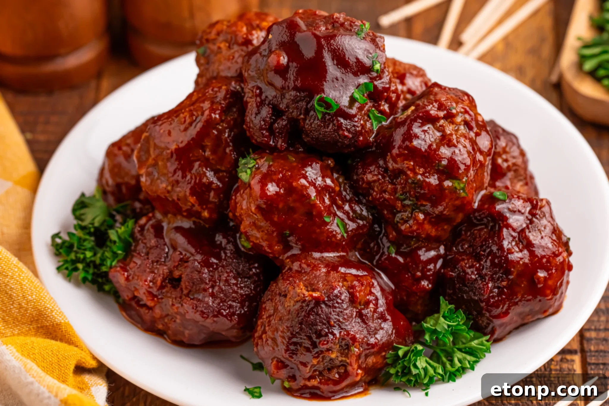 Slow-Cooker BBQ Meatball Magic 20 Crockpot Homemade BBQ Meatballs piled high on a white plate
