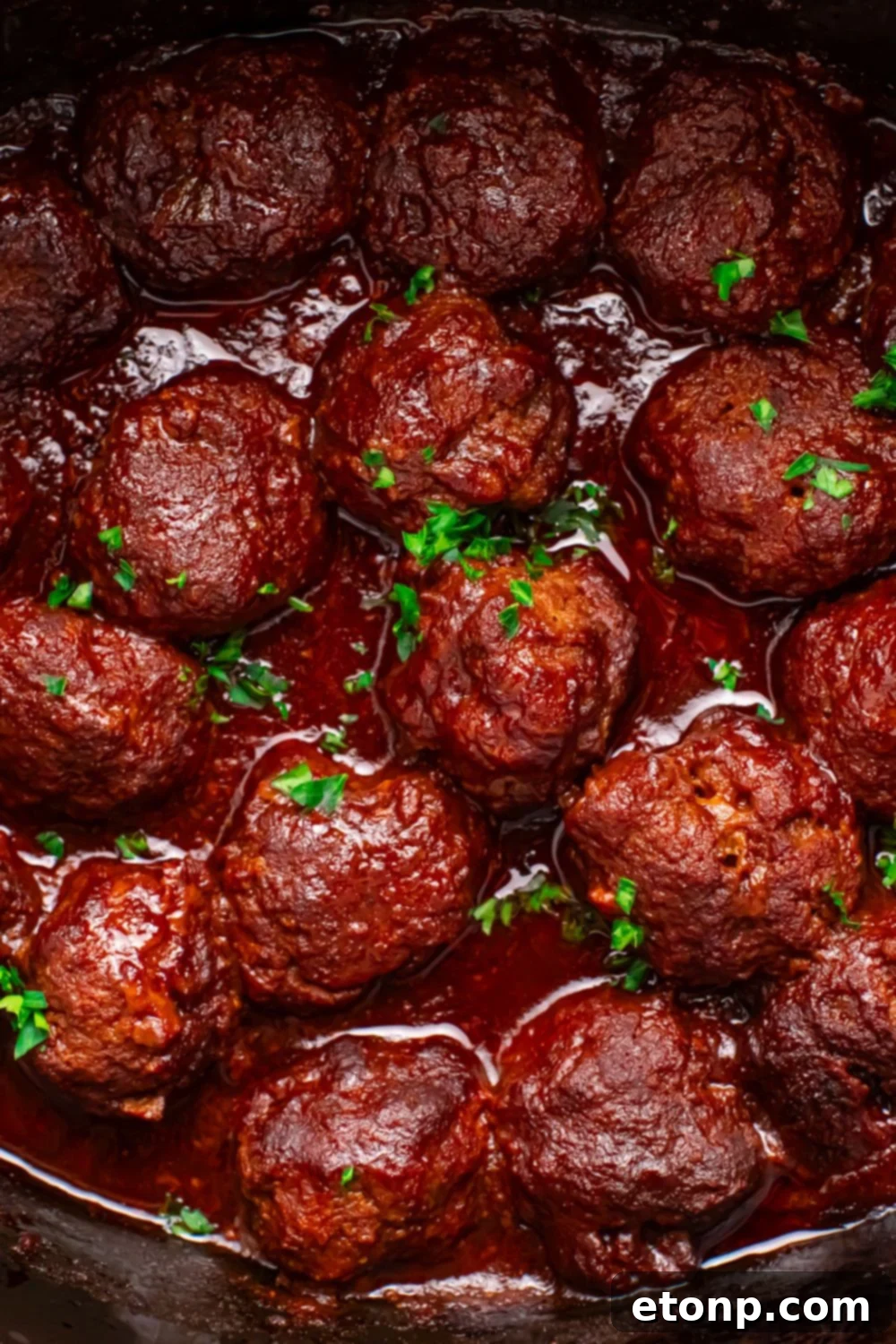 Slow-Cooker BBQ Meatball Magic 22 CrockPot full of meatballs topped with parsley