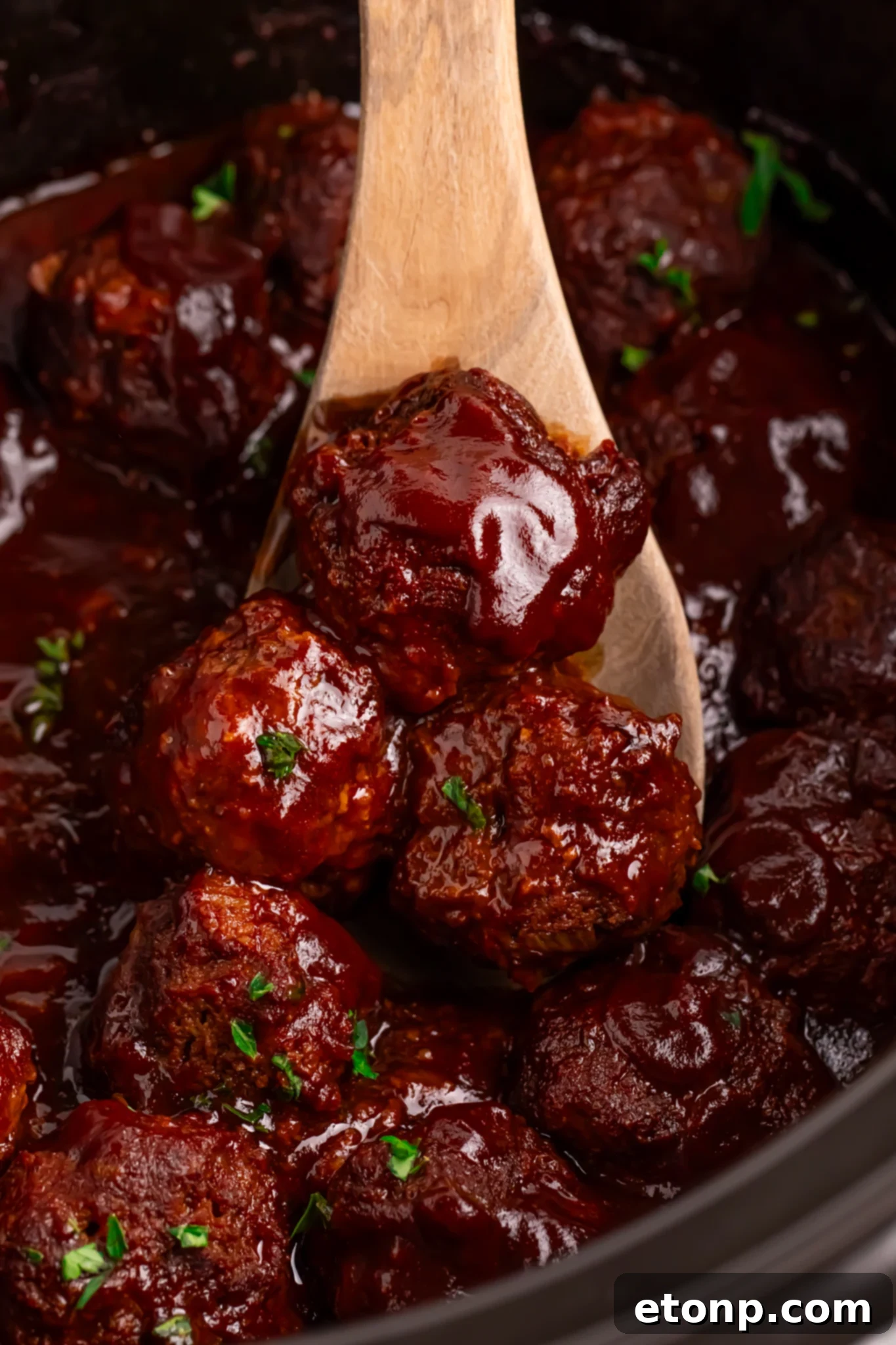 Slow-Cooker BBQ Meatball Magic 25 Crockpot Homemade BBQ Meatballs in a black slow cooker