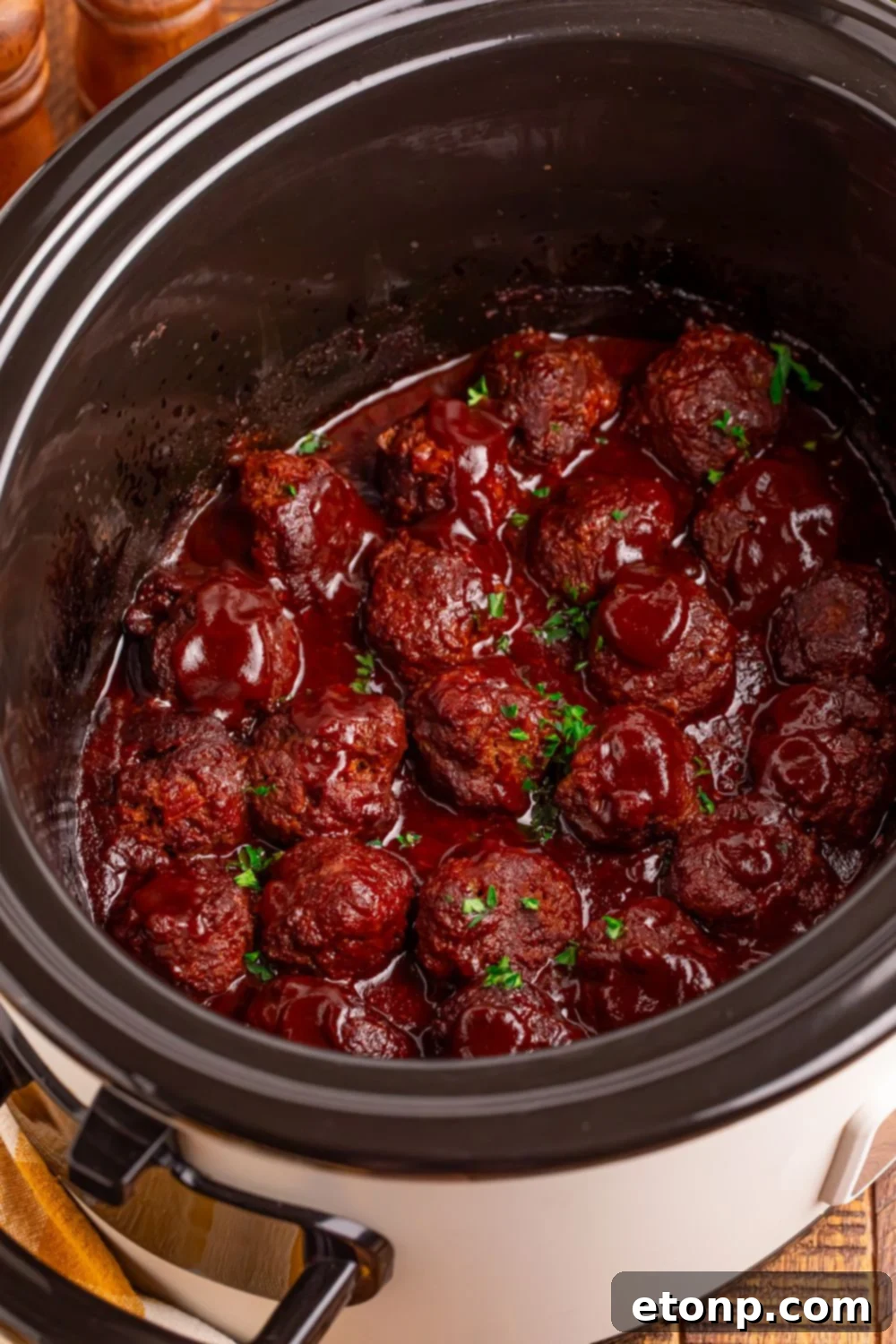 Slow-Cooker BBQ Meatball Magic 9 Overhead view of Crockpot Homemade BBQ Meatballs on a table