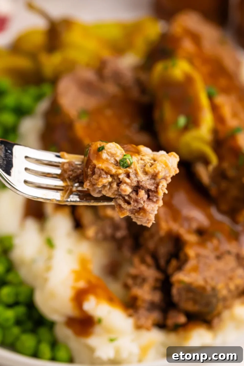Crockpot Mississippi Meatloaf with mashed potatoes and peas
