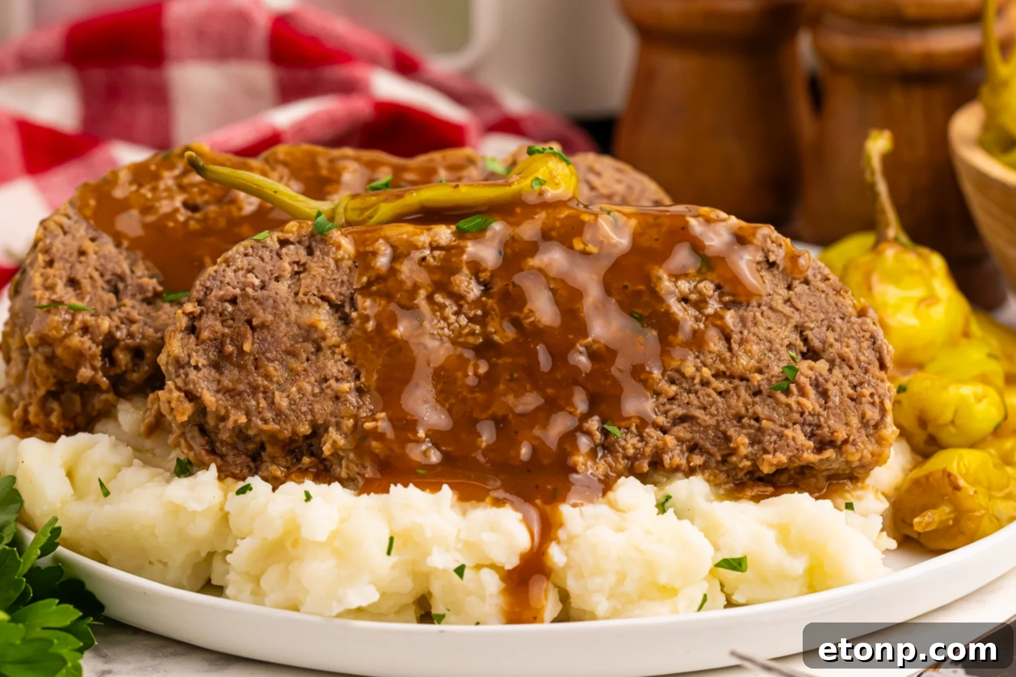 Crockpot Mississippi Meatloaf on mashed potatoes