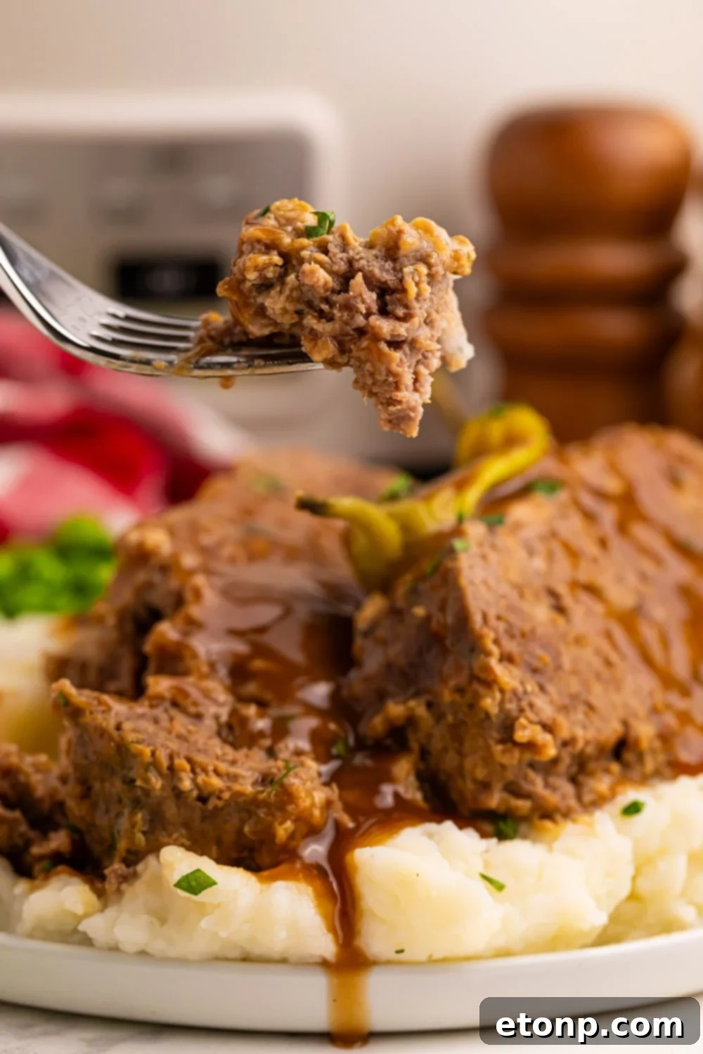 Sliced Crockpot Mississippi Meatloaf on a plate