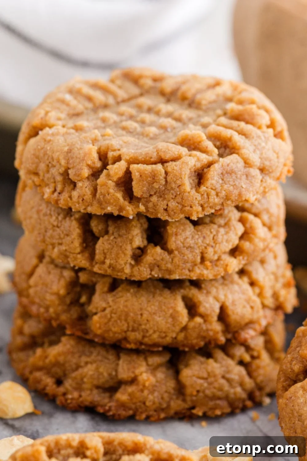 Four-Ingredient Peanut Butter Bliss: The Simplest Cookie Recipe Ever 20 Stack of peanut butter cookies with nuts