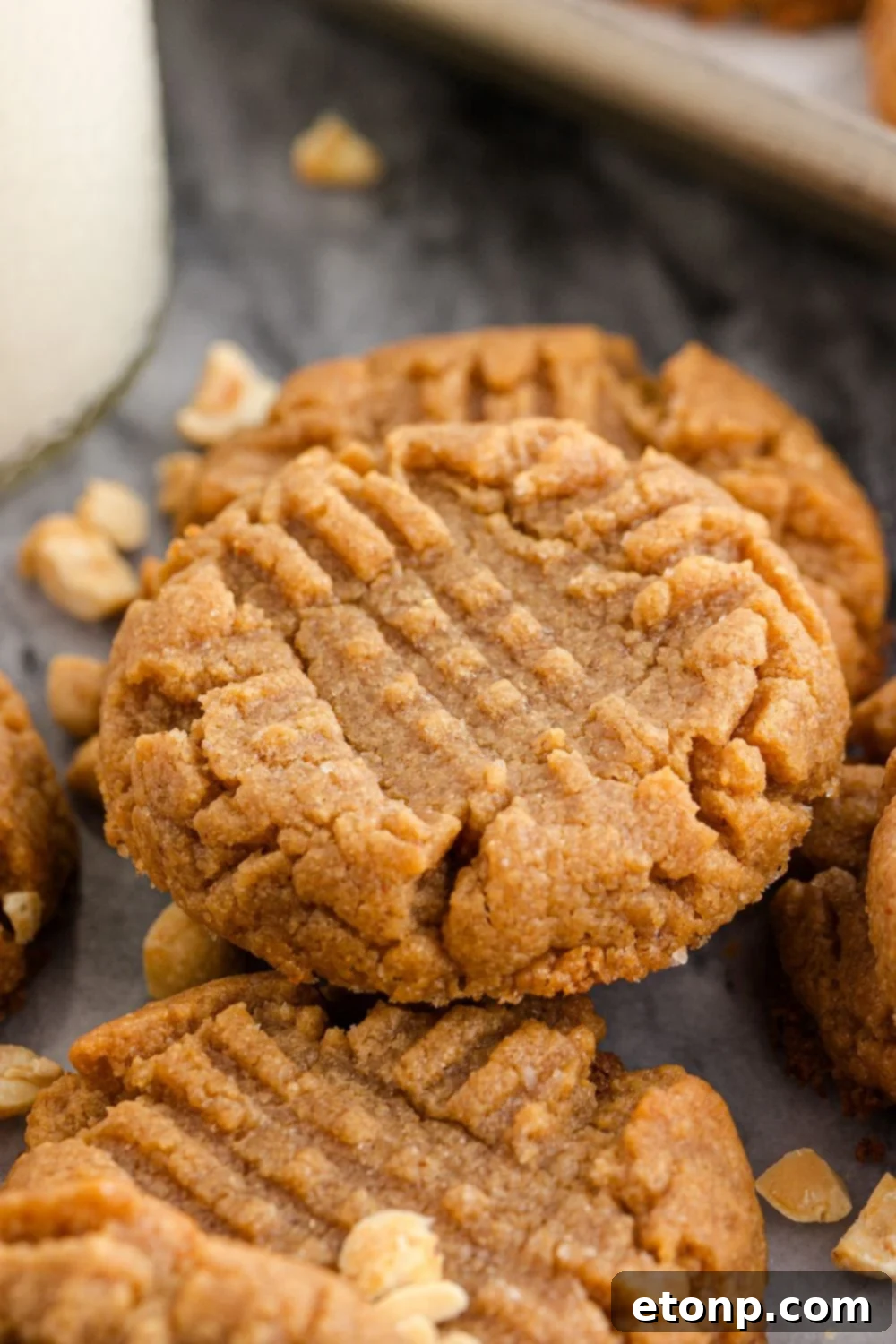 Four-Ingredient Peanut Butter Bliss: The Simplest Cookie Recipe Ever 21 Marble counter with milk and nuts